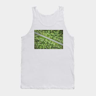 Empty road going diagonally through the forest top down aerial view Tank Top